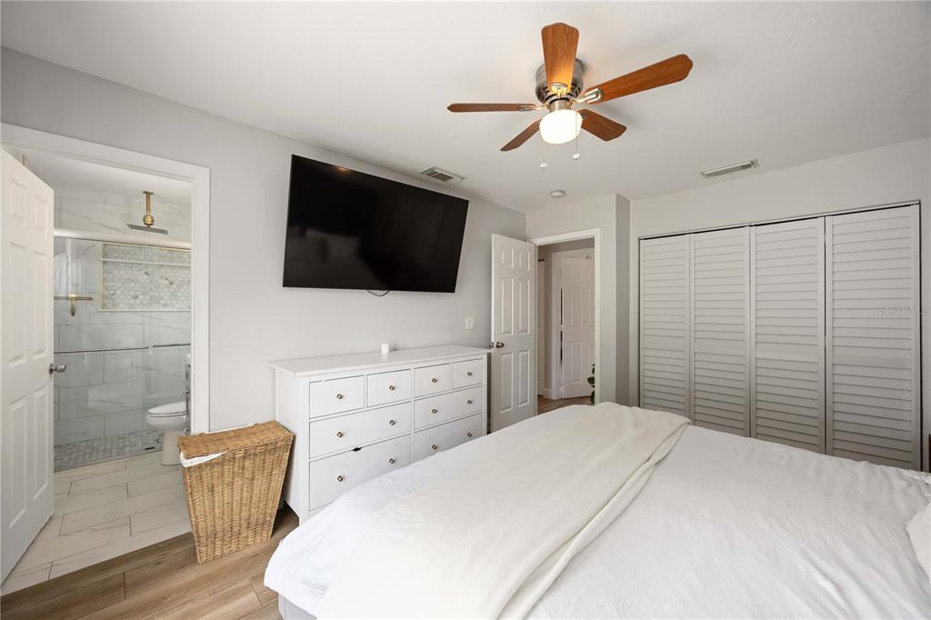 6775 Dennison Avenue North Port, FL 34287 - Photo 25 of 50 a bedroom with a bed and a flat screen tv