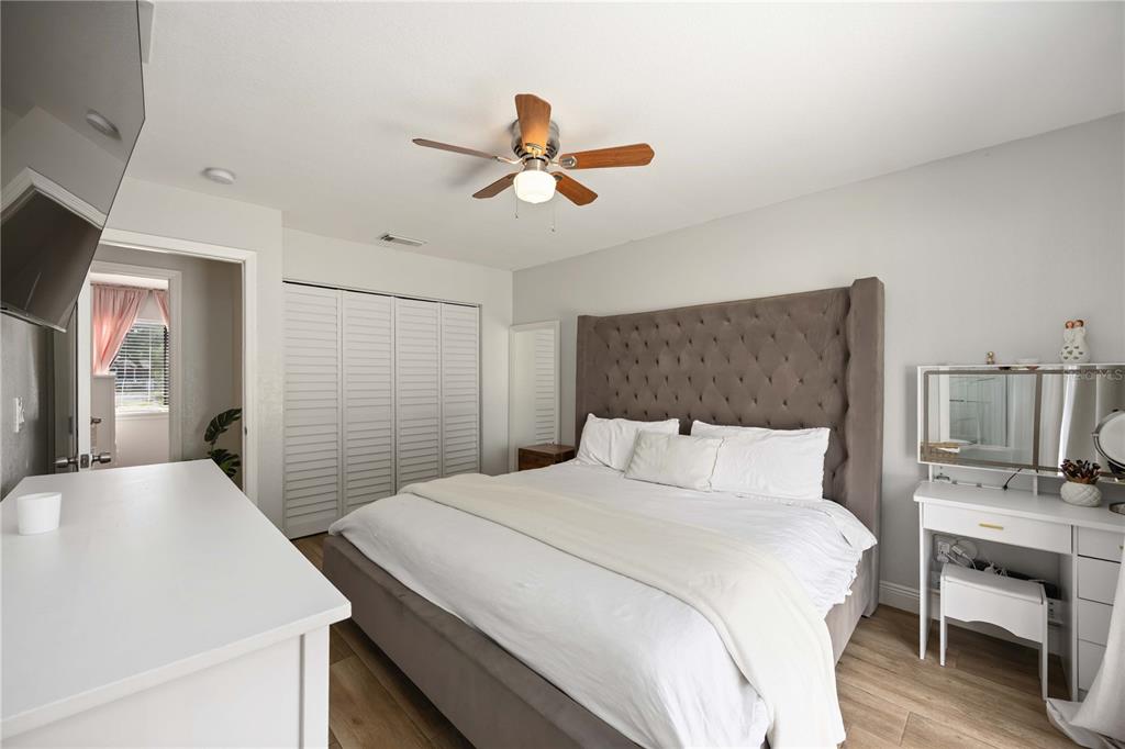 6775 Dennison Avenue North Port, FL 34287 - Photo 26 of 50 a bedroom with a bed and a chandelier