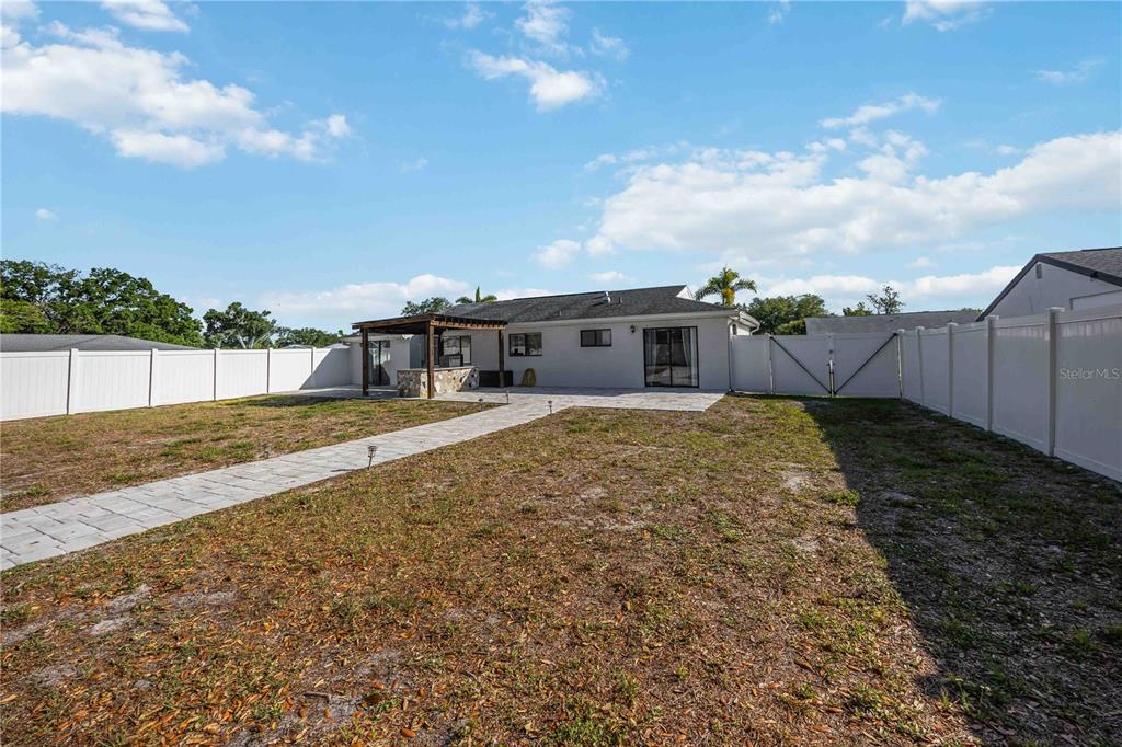 6775 Dennison Avenue North Port, FL 34287 - Photo 30 of 50 a view of a house with a yard