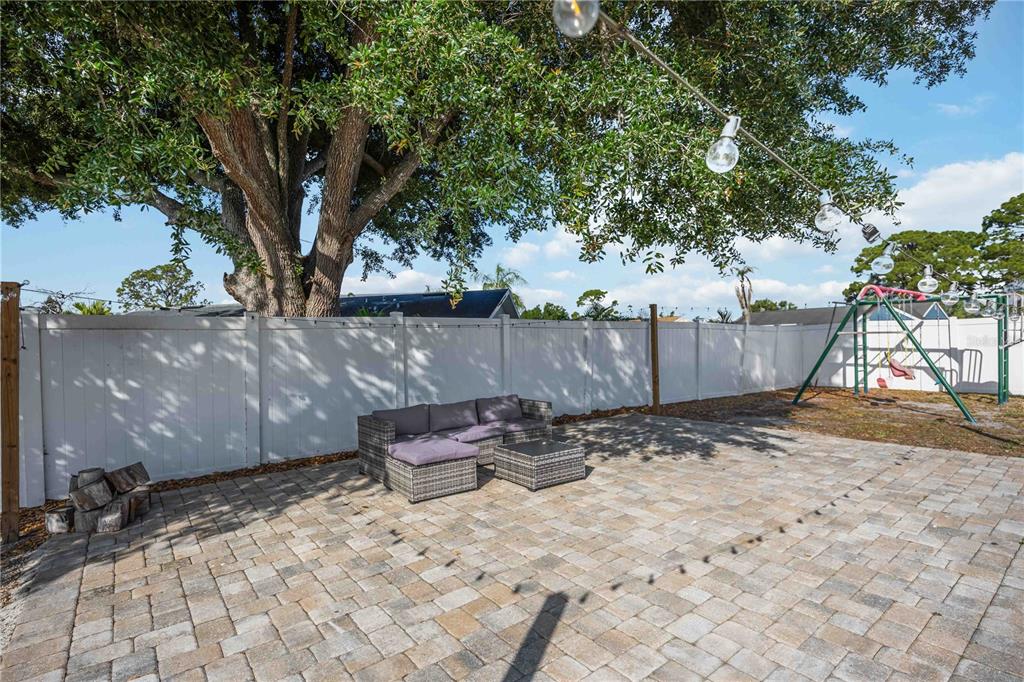 6775 Dennison Avenue North Port, FL 34287 - Photo 31 of 50 a backyard of a house with table and chairs