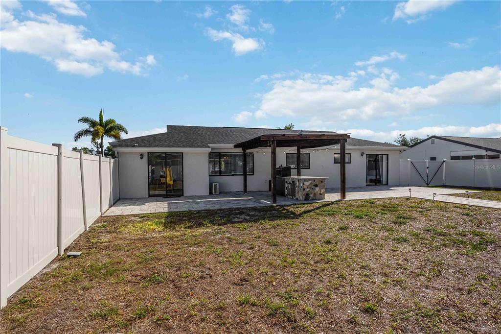 6775 Dennison Avenue North Port, FL 34287 - Photo 33 of 50 a front view of a house with a garden and yard