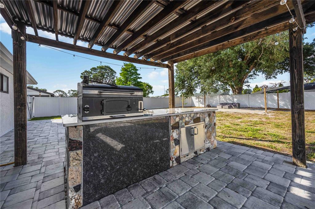 6775 Dennison Avenue North Port, FL 34287 - Photo 35 of 50 a kitchen with a stove and a microwave oven
