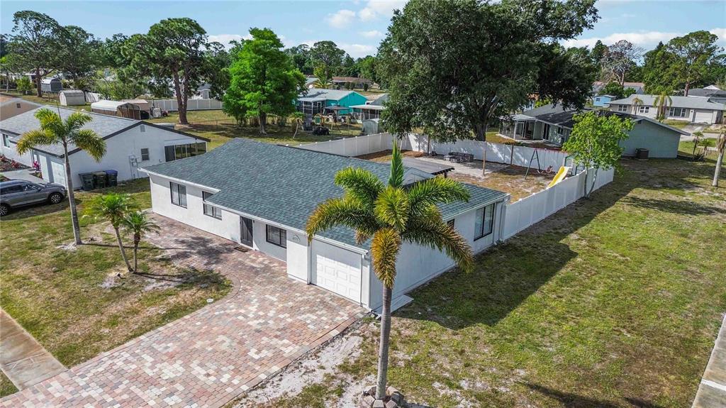 6775 Dennison Avenue North Port, FL 34287 - Photo 41 of 50 a view of a house with a yard