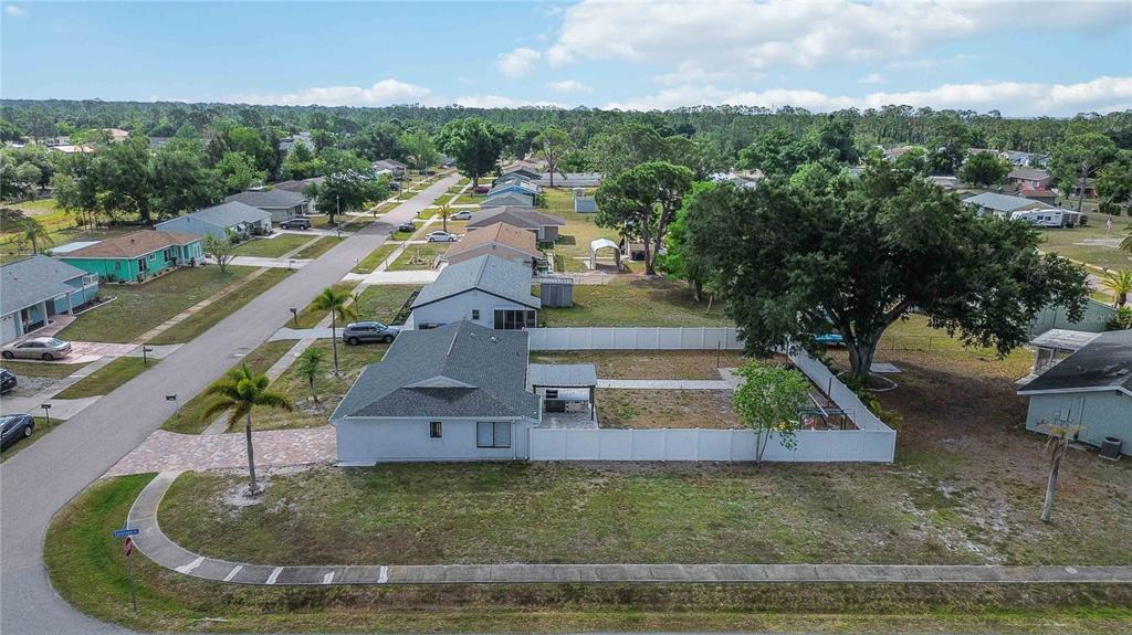 6775 Dennison Avenue North Port, FL 34287 - Photo 46 of 50 a view of a house with a yard