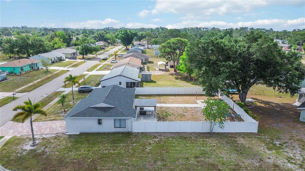 6775 Dennison Avenue North Port, FL 34287 - Photo 47 of 50 an aerial view of residential houses with outdoor space and trees