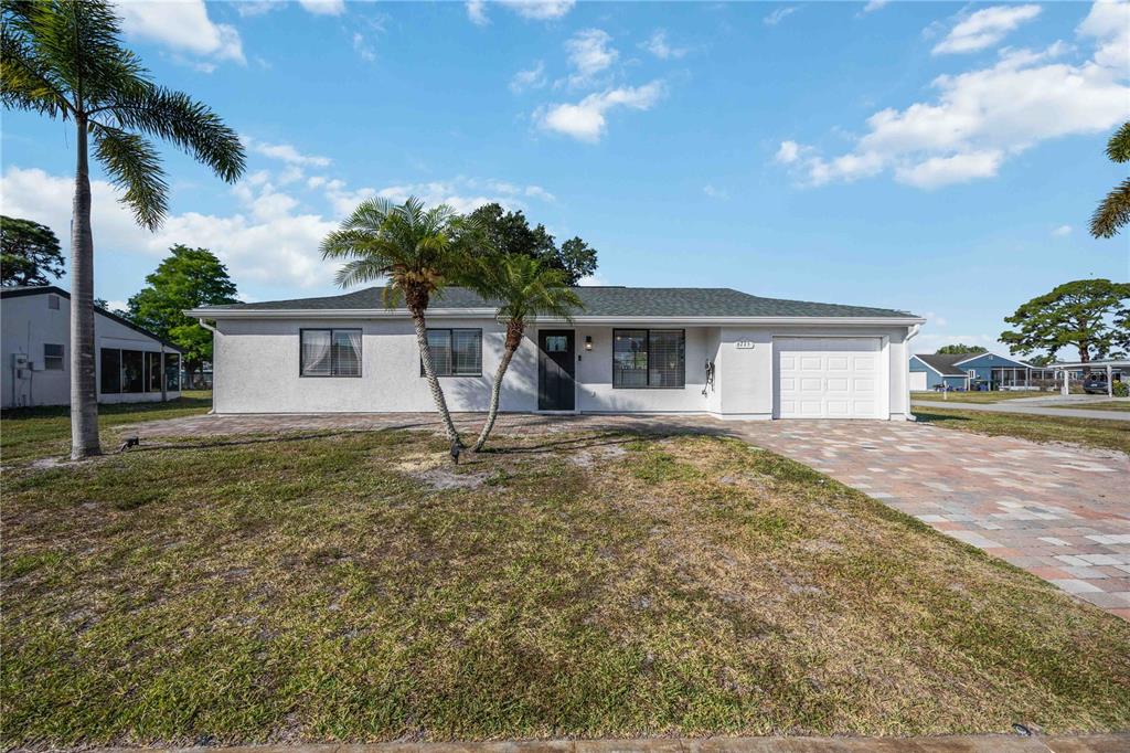 6775 Dennison Avenue North Port, FL 34287 - Photo 48 of 50 a house with lots of trees in the background