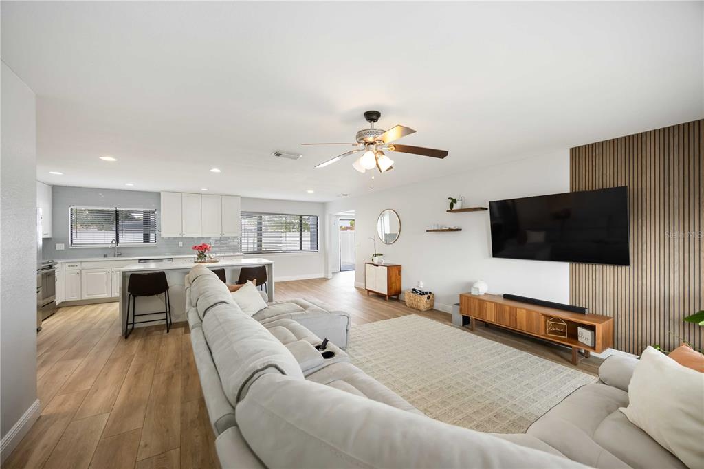 6775 Dennison Avenue North Port, FL 34287 - Photo 6 of 50 a living room with furniture and a flat screen tv