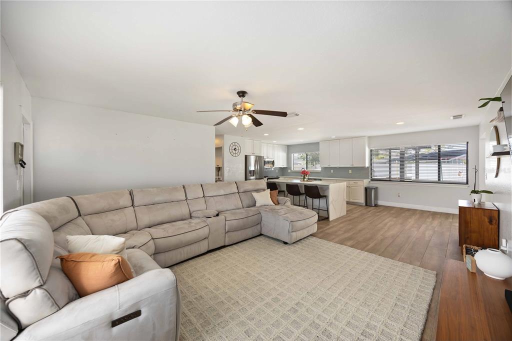 6775 Dennison Avenue North Port, FL 34287 - Photo 8 of 50 a living room with furniture and a wooden floor