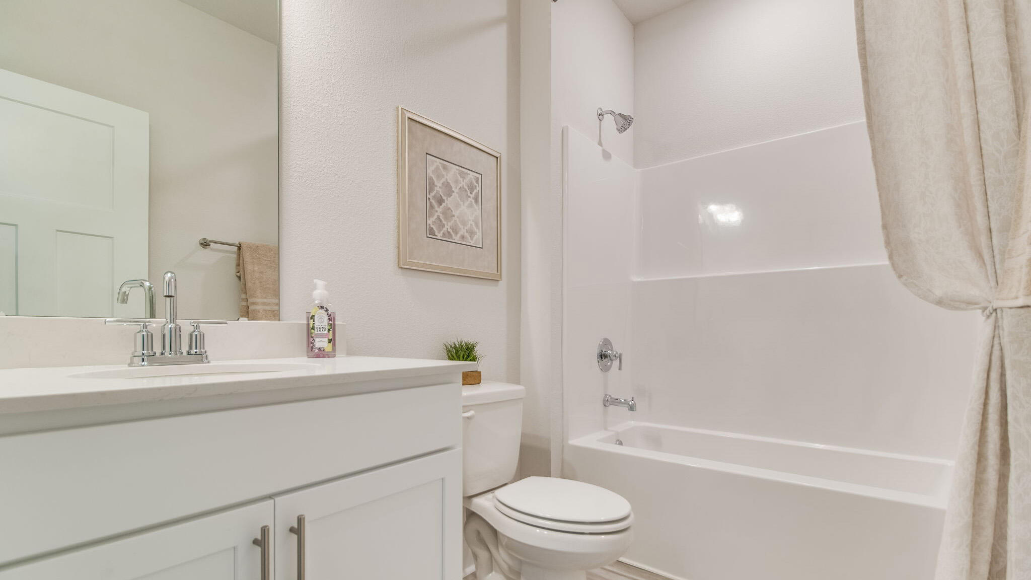5844 Dove Nest Road Gulf Breeze, FL 32563 - Photo 27 of 32 a bathroom with a sink a toilet and a bathtub