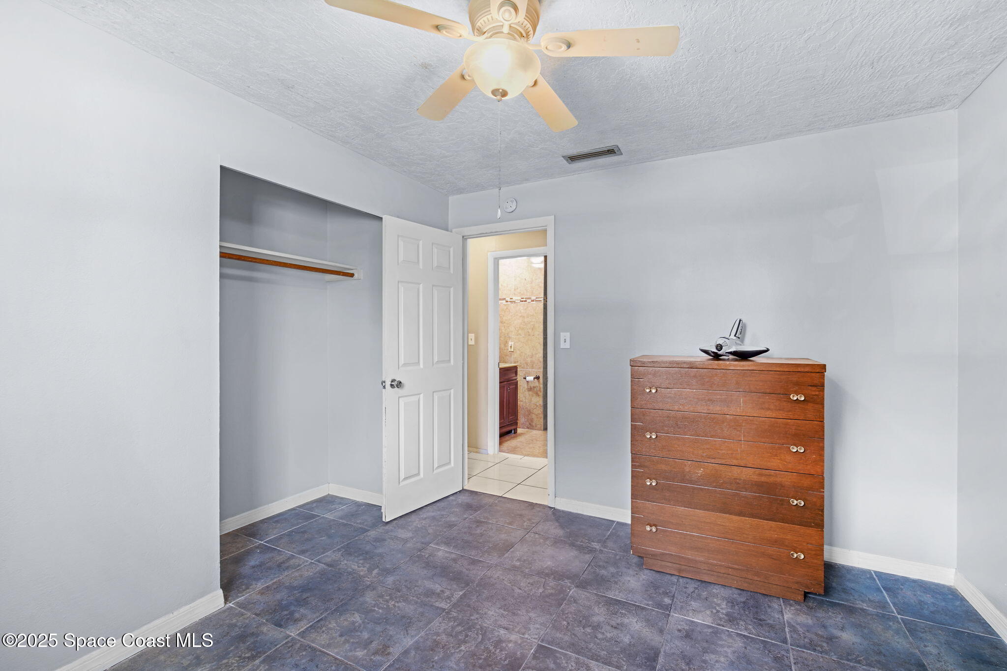 1044 Pompano Drive Rockledge, FL 32955 - Photo 16 of 28 a view of room with a ceiling fan