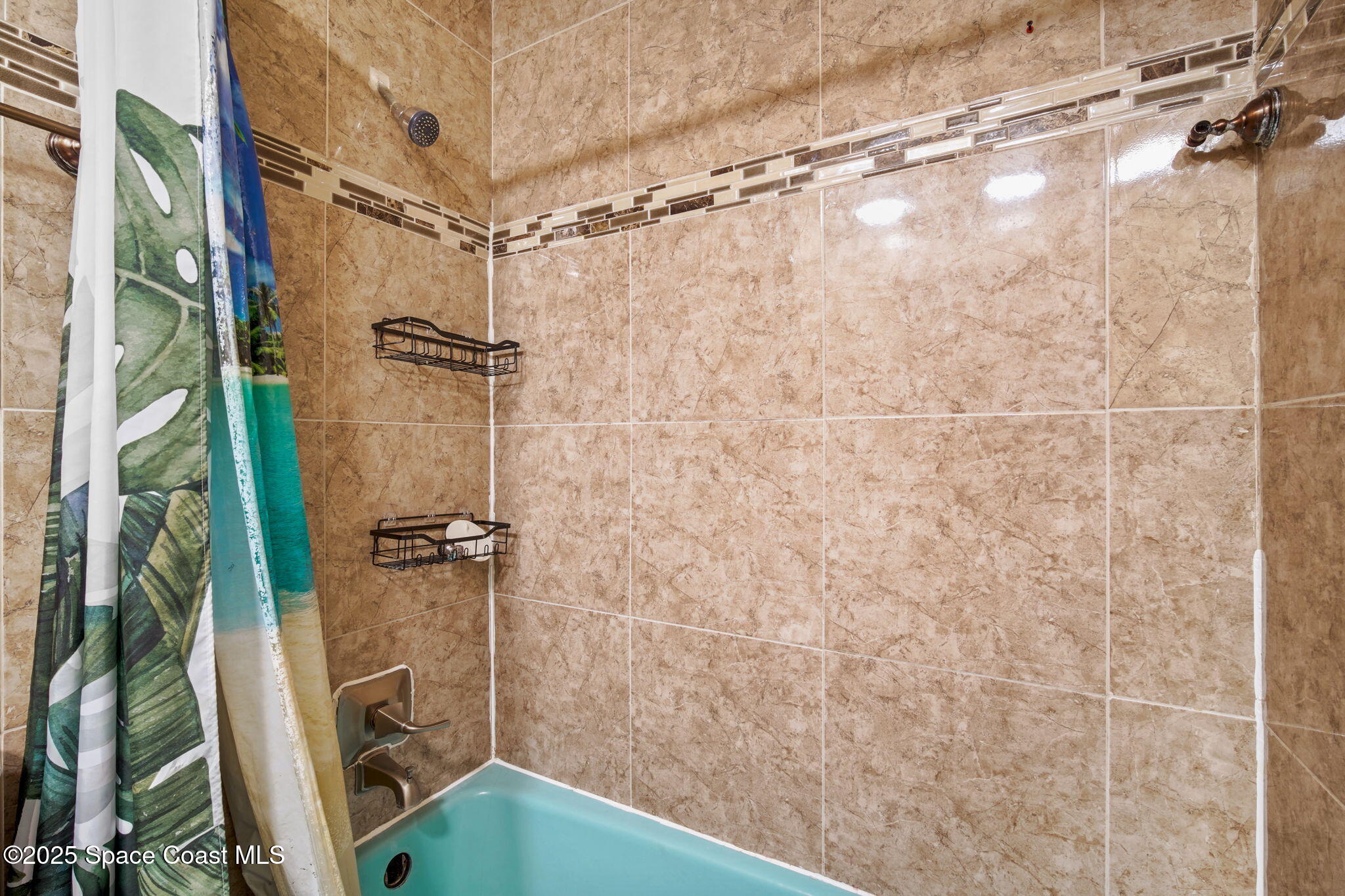 1044 Pompano Drive Rockledge, FL 32955 - Photo 18 of 28 a bathroom with a shower and a tub