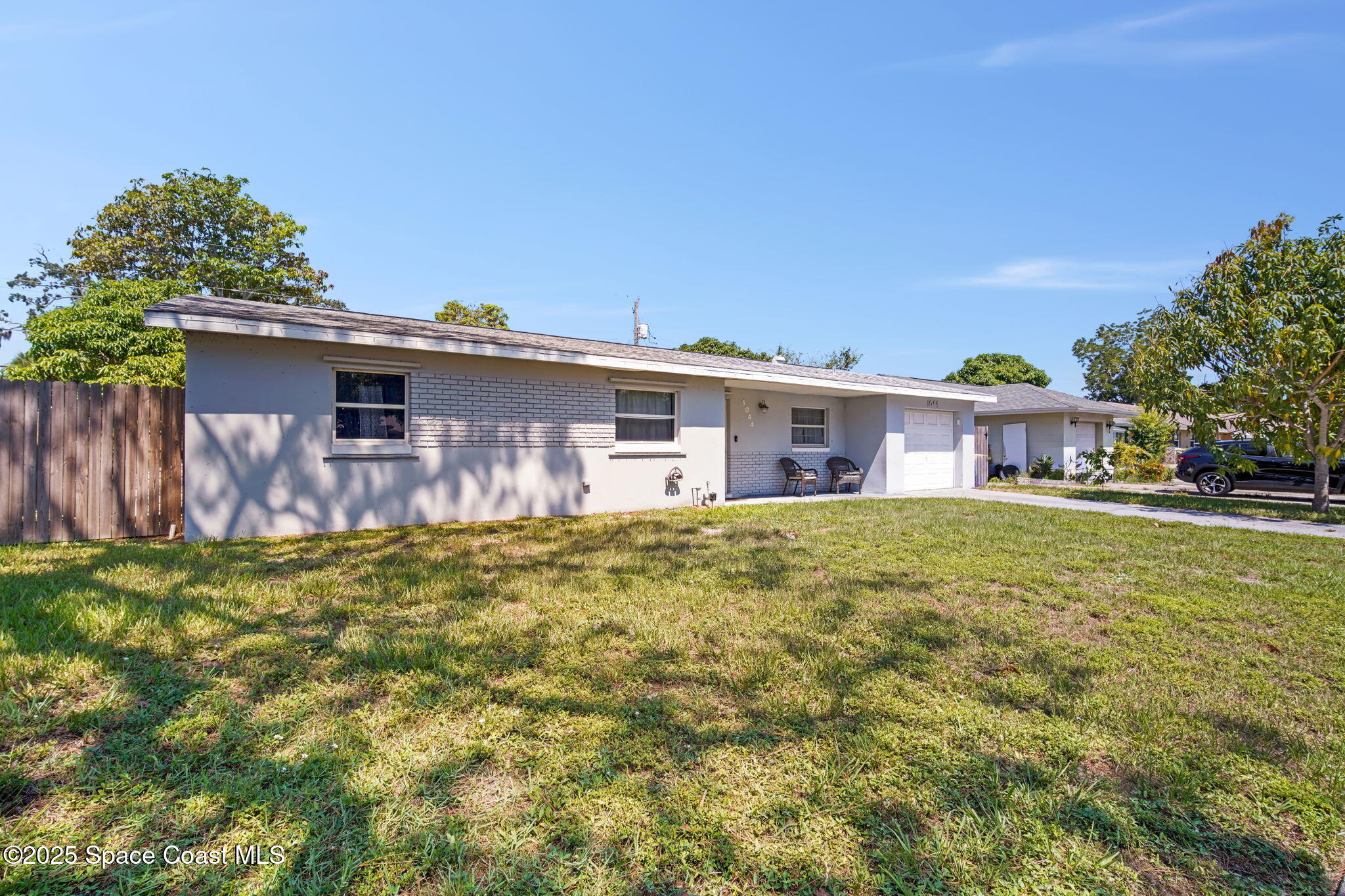1044 Pompano Drive Rockledge, FL 32955 - Photo 4 of 28 a front view of a house with a yard