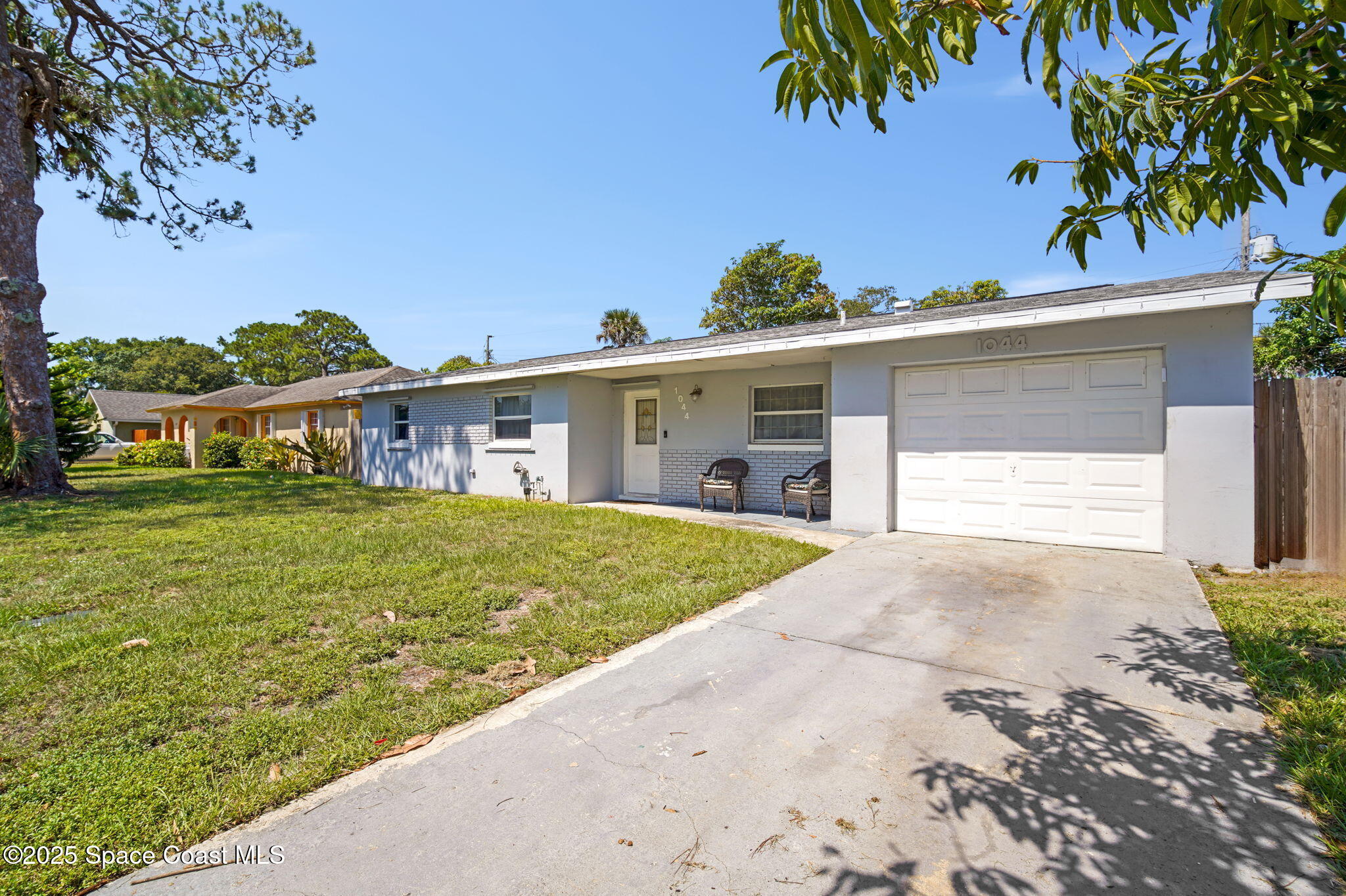 1044 Pompano Drive Rockledge, FL 32955 - Photo 5 of 28 front view of a house with a yard