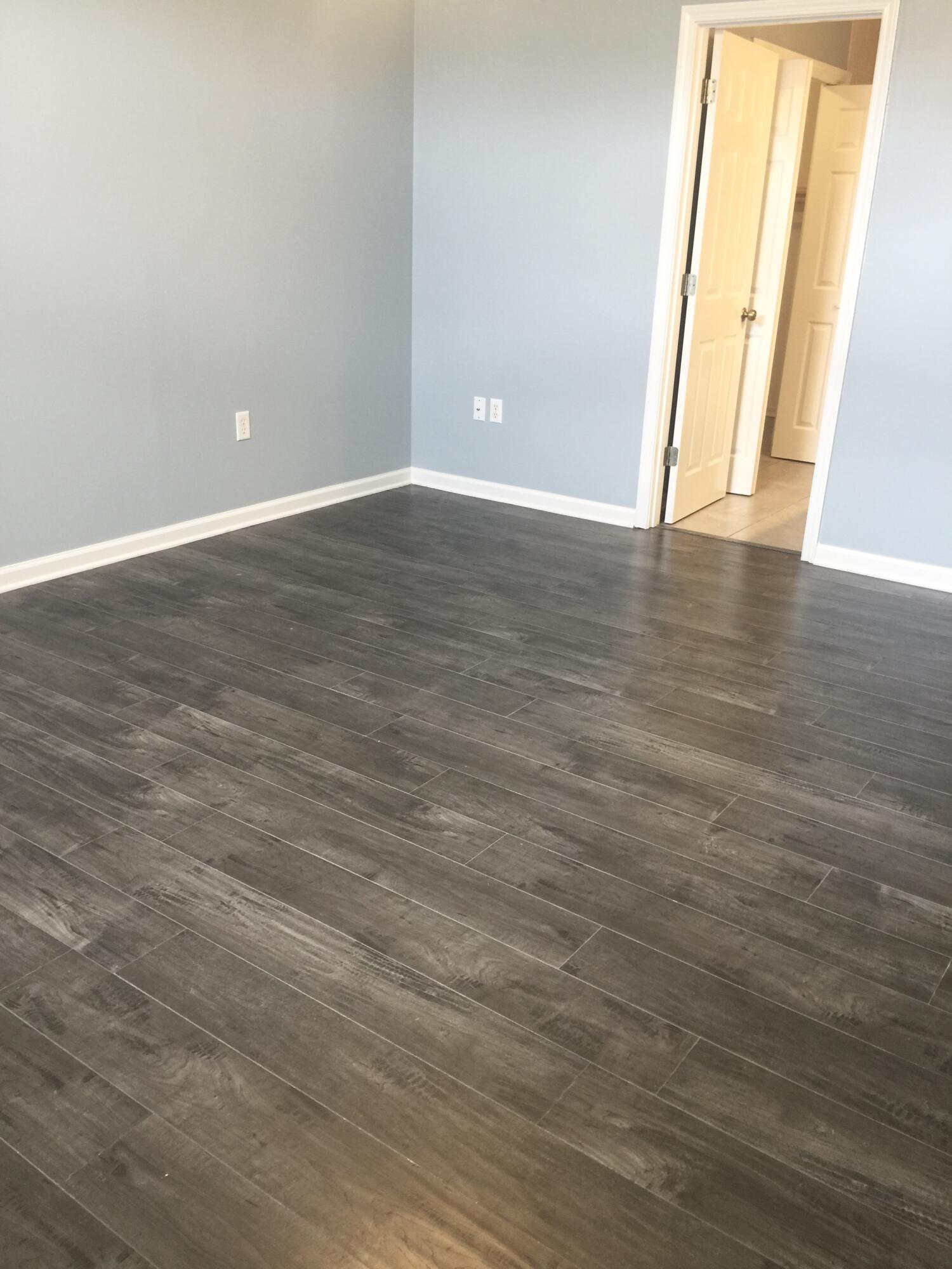 3429 Melissa Lane Crestview, FL 32539 - Photo 11 of 28 a view of an empty room with wooden floor and a window