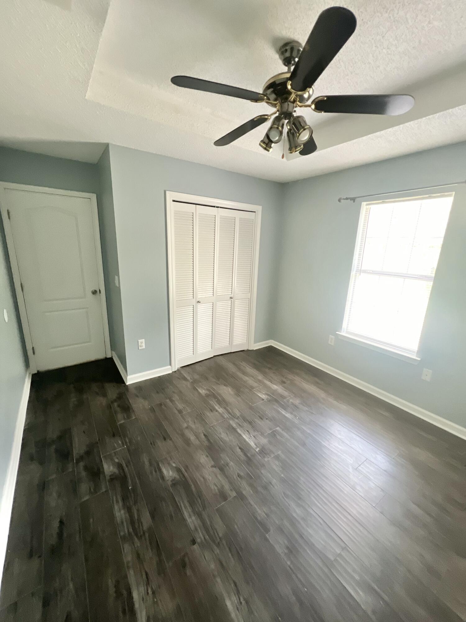 3429 Melissa Lane Crestview, FL 32539 - Photo 16 of 28 a view of empty room with wooden floor