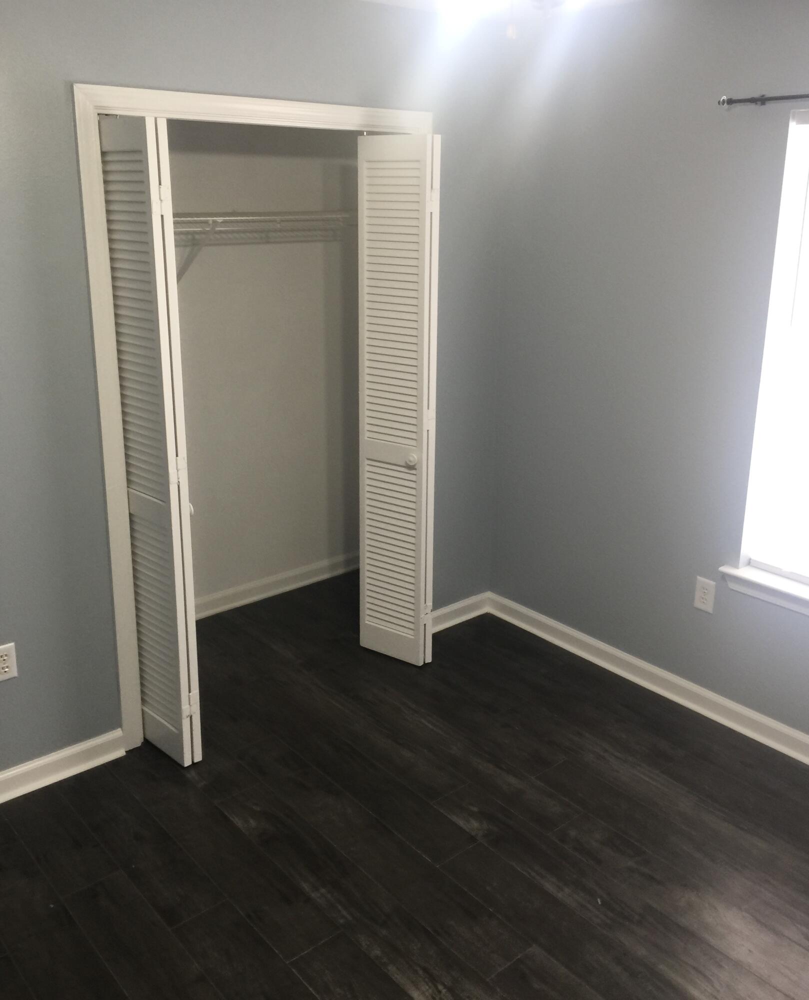 3429 Melissa Lane Crestview, FL 32539 - Photo 18 of 28 an empty room with wooden floor and closet