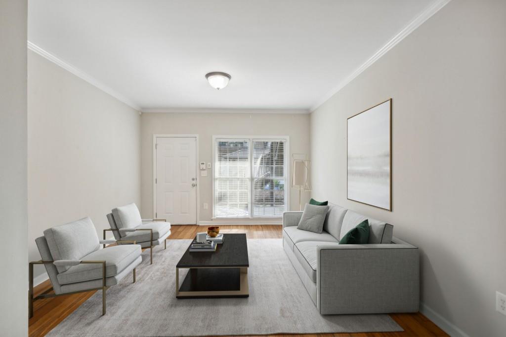 3675 Peachtree Road Northeast, Unit 57 Atlanta, GA 30319 - Photo 1 of 1 a living room with furniture and a large window