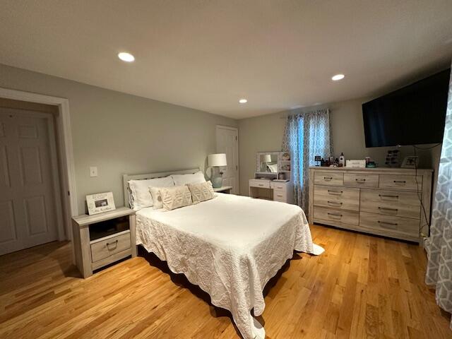 89 Mitchells Way Hyannis, MA 02601 - Photo 14 of 33 a spacious bedroom with a bed and wooden floor