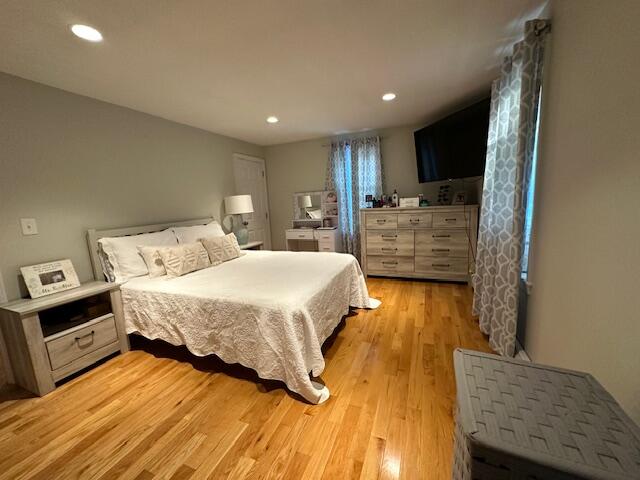 89 Mitchells Way Hyannis, MA 02601 - Photo 16 of 33 a bed room with a bed and a night stand