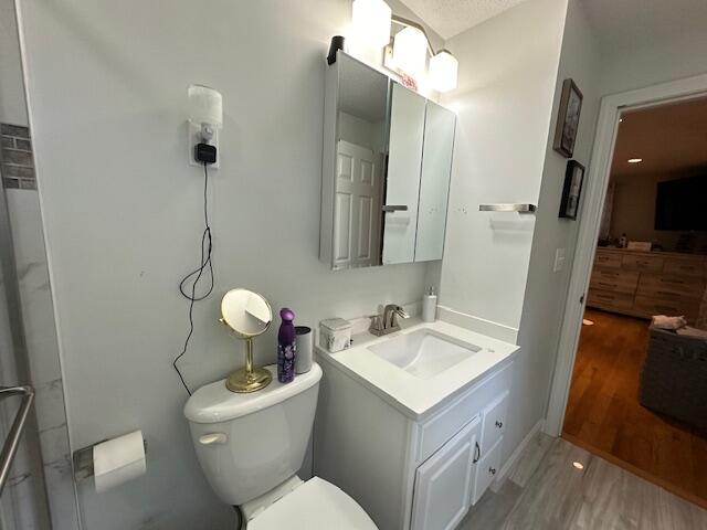 89 Mitchells Way Hyannis, MA 02601 - Photo 19 of 33 a bathroom with a toilet sink and mirror