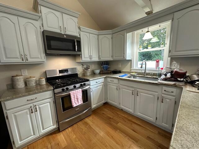 89 Mitchells Way Hyannis, MA 02601 - Photo 2 of 33 a kitchen with stainless steel appliances granite countertop white cabinets granite counter tops and a window
