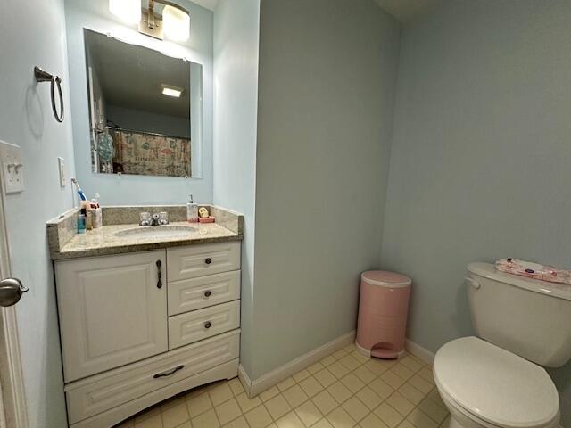 89 Mitchells Way Hyannis, MA 02601 - Photo 26 of 33 a bathroom with a granite countertop toilet sink and mirror