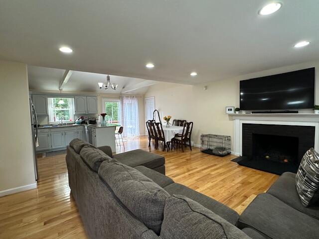 89 Mitchells Way Hyannis, MA 02601 - Photo 9 of 33 a living room with furniture fireplace and flat screen tv