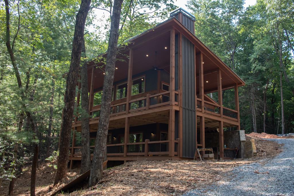 7 Clay's Way Cherry Log, GA 30522 - Photo 2 of 6 a view of a house with backyard and trees