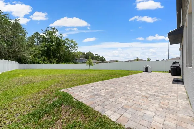 an aerial view of a house with pool