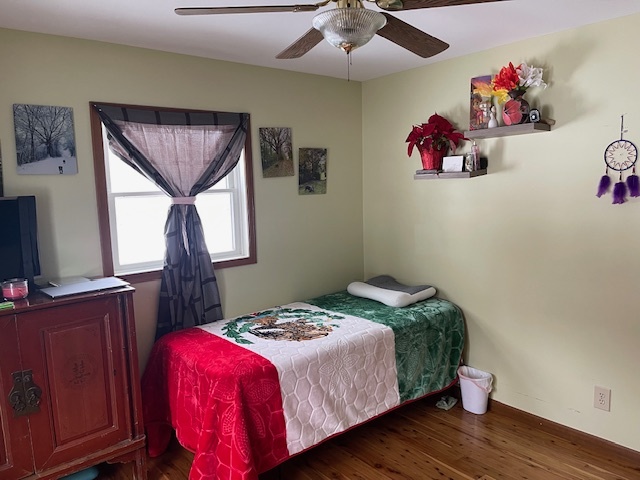 2365 West Southmor Road Morris, IL 60450 - Photo 16 of 25 a bedroom with a bed and wooden floor