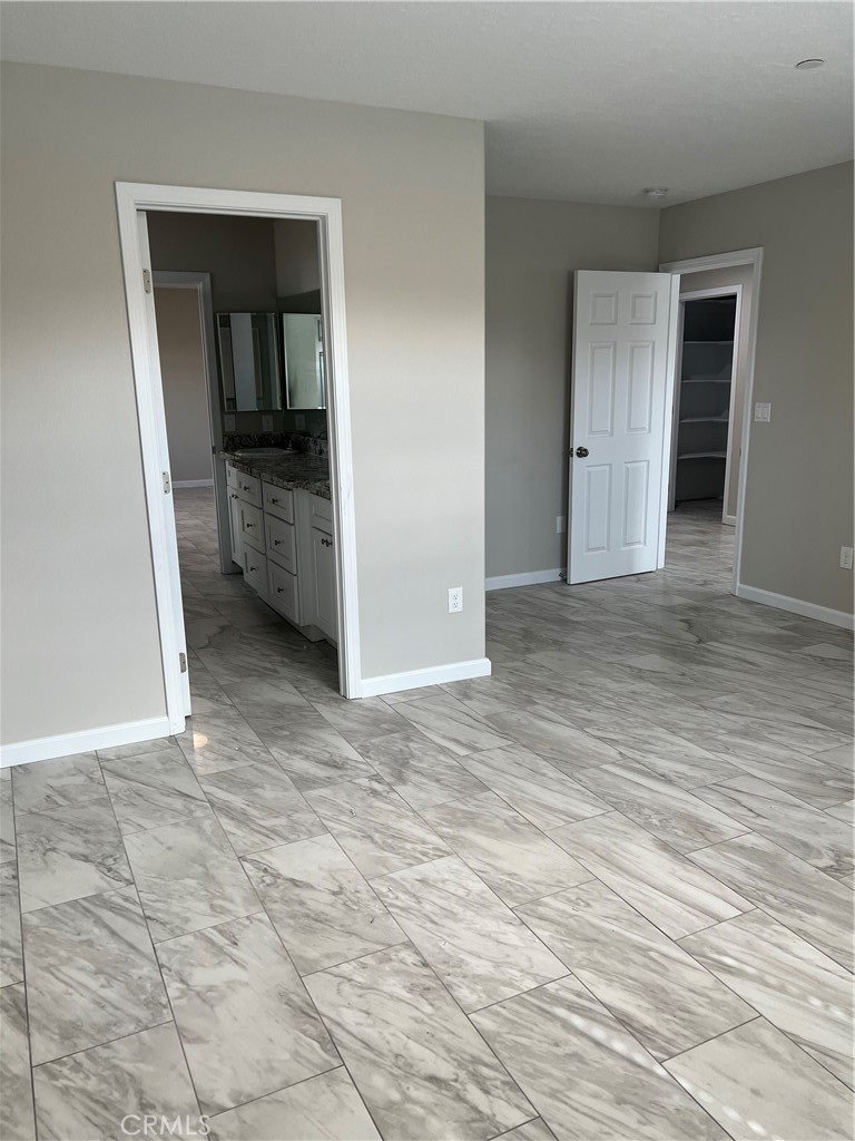 16550 Olive Street Hesperia, CA 92345 - Photo 6 of 9 a view of an empty room and bathroom