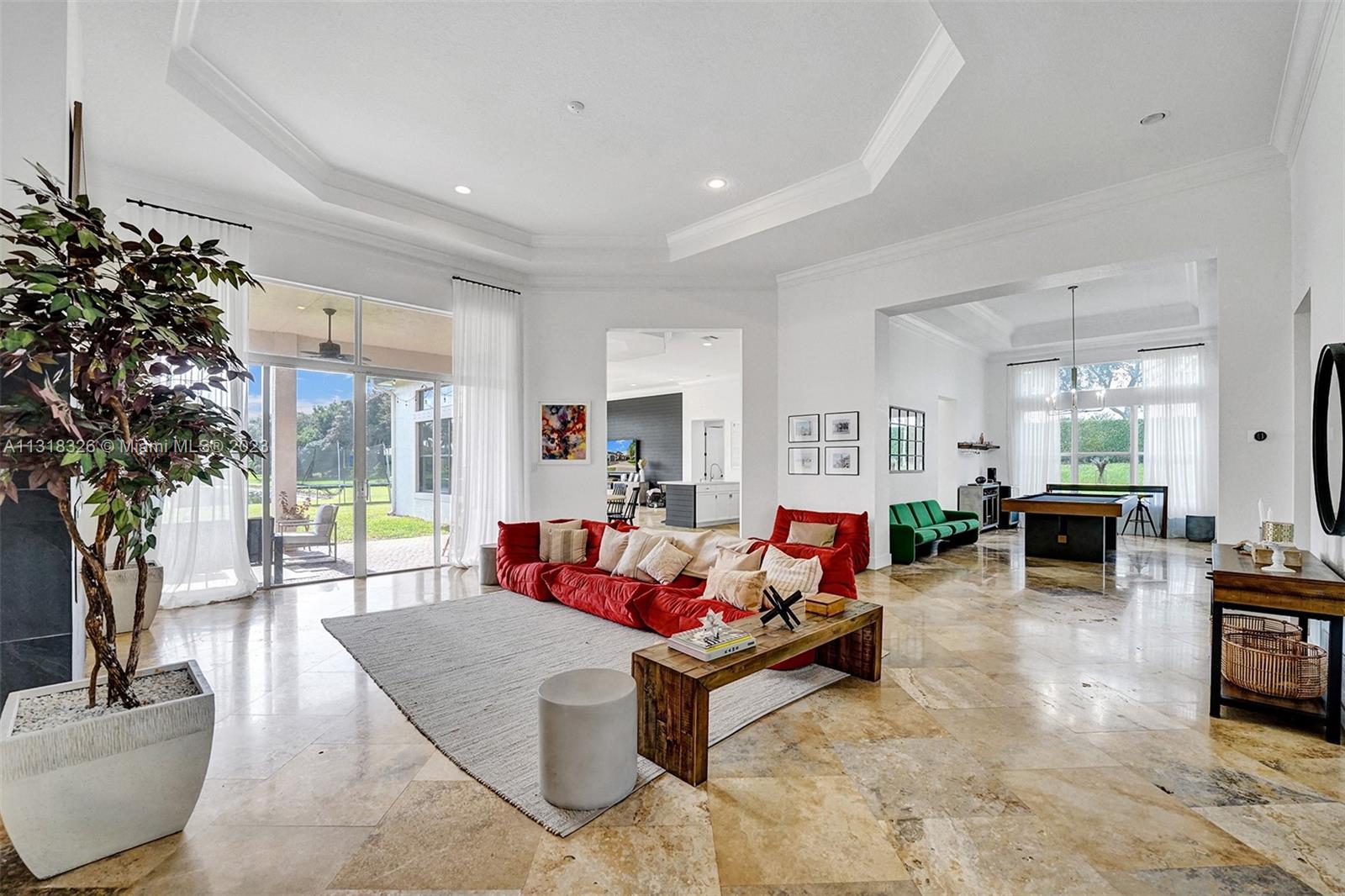 Davie Davie, FL 33331 - Photo 17 of 84 a living room with fireplace furniture and a large window