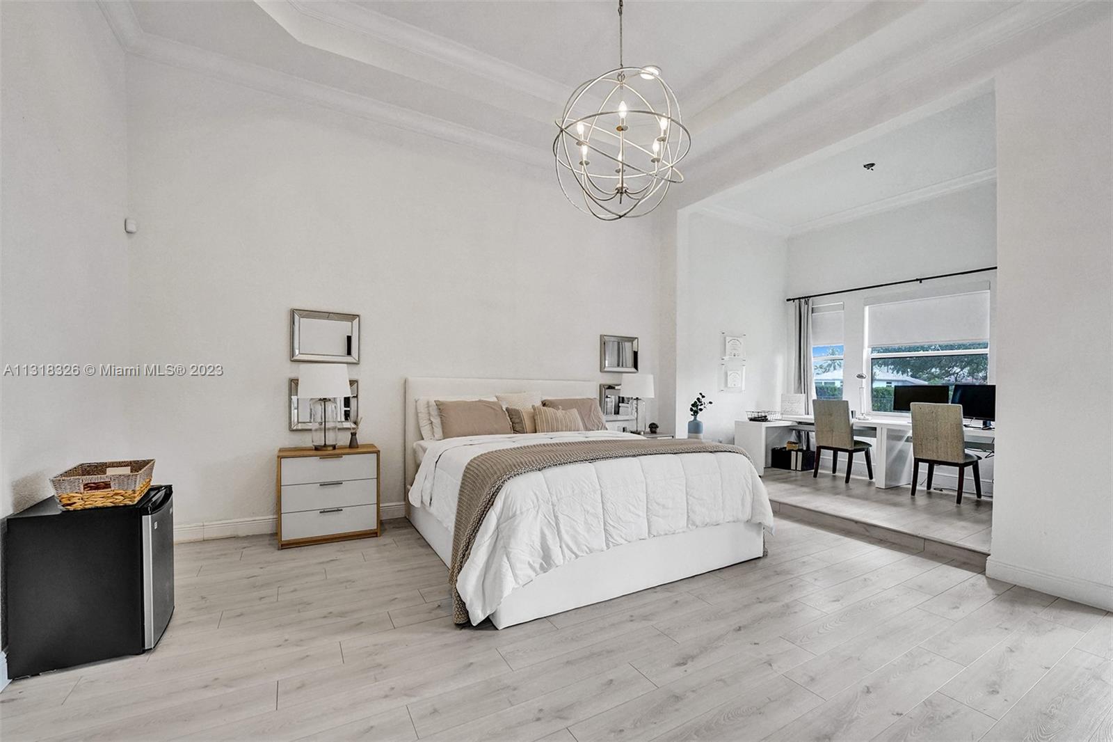 Davie Davie, FL 33331 - Photo 61 of 84 a spacious bedroom with a bed and a table in it