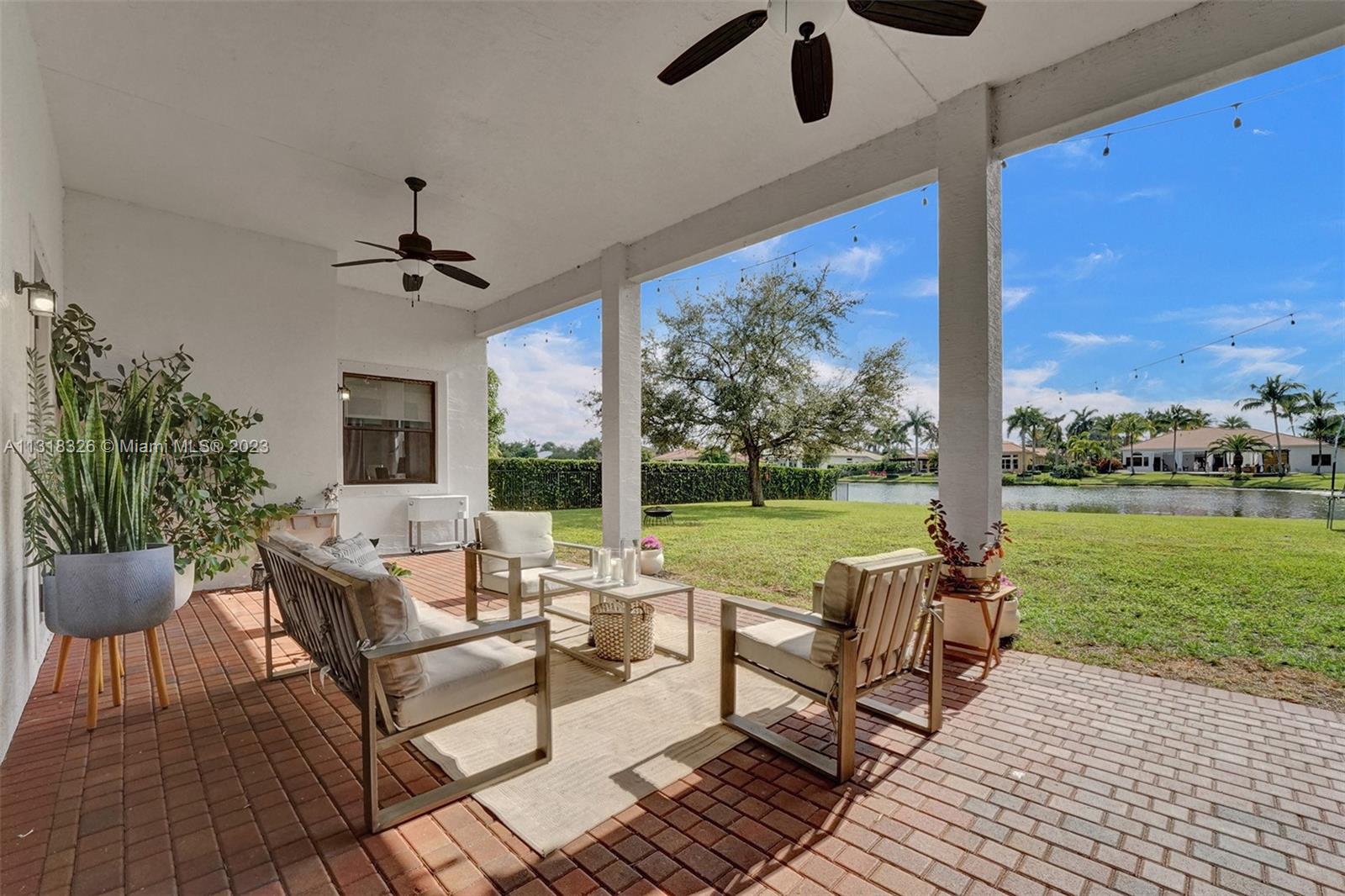 Davie Davie, FL 33331 - Photo 71 of 84 a living room with patio furniture and a garden