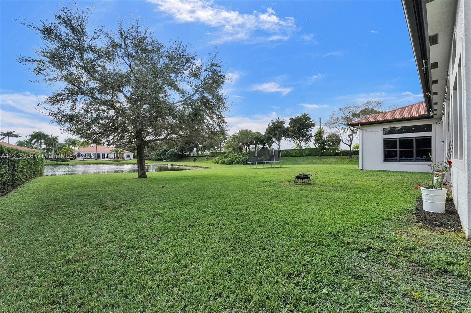 Davie Davie, FL 33331 - Photo 75 of 84 a view of a house with a backyard