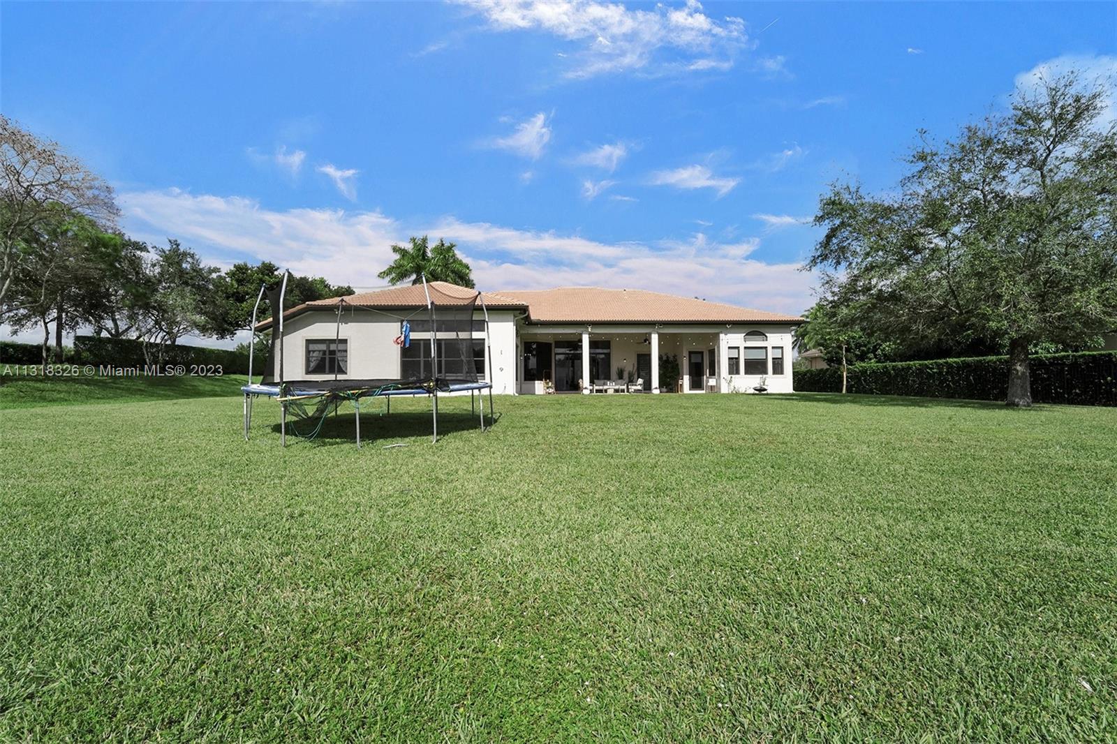Davie Davie, FL 33331 - Photo 79 of 84 a front view of a house with a yard