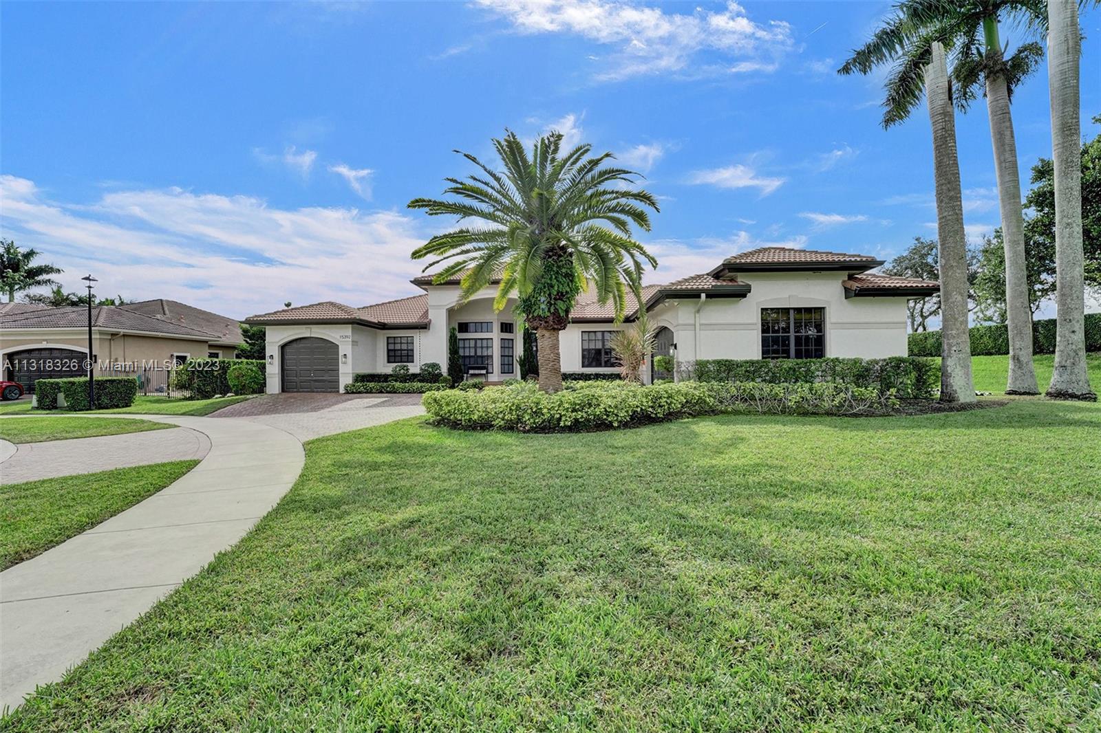 Davie Davie, FL 33331 - Photo 9 of 84 a view of a house with a big yard plants and palm trees