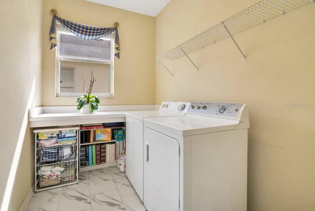a utility room with washer and dryer