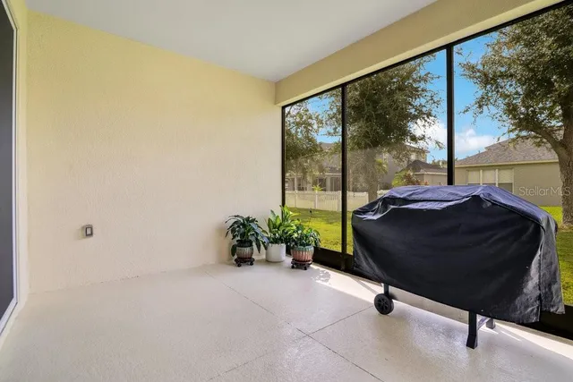 a living room with a couch and a large window
