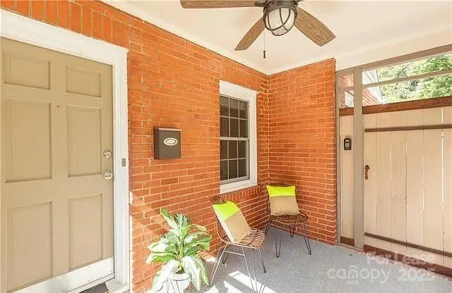 a view of a patio with a table and chairs