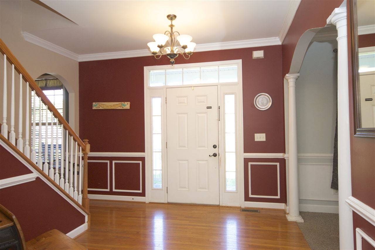 33 Haversack Road Palmyra, VA 22963 - Photo 4 of 22 a view of a livingroom with wooden floor and stairs