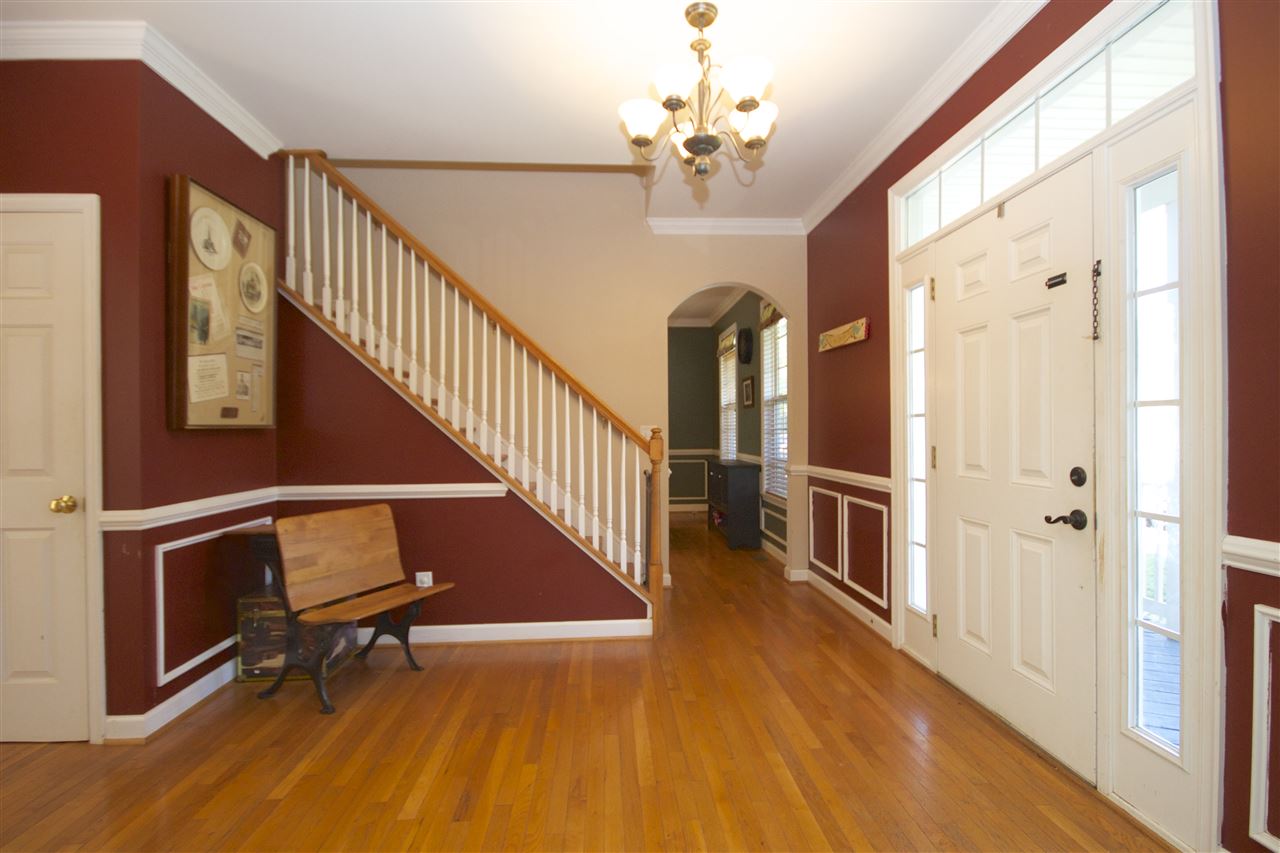 33 Haversack Road Palmyra, VA 22963 - Photo 5 of 22 a view of a hallway with wooden floor and staircase