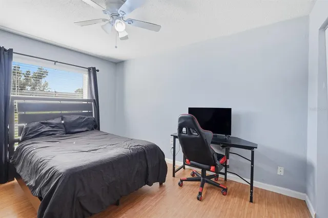 a bed room with a bed and gym equipment