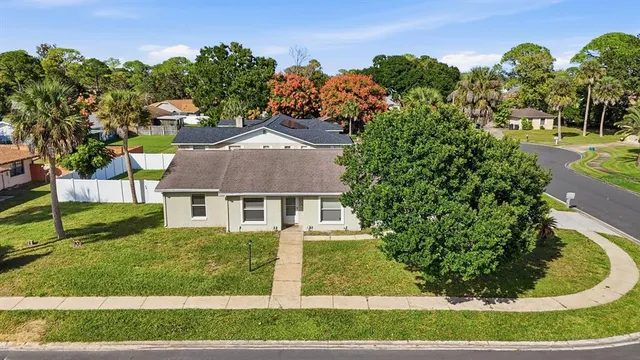 a view of a swimming pool with a yard