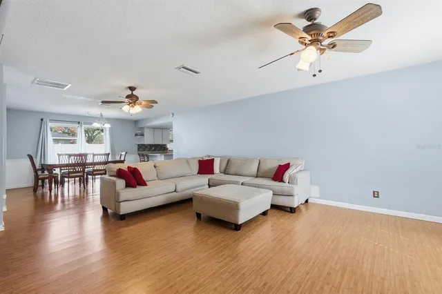 a bedroom with furniture and a flat screen tv