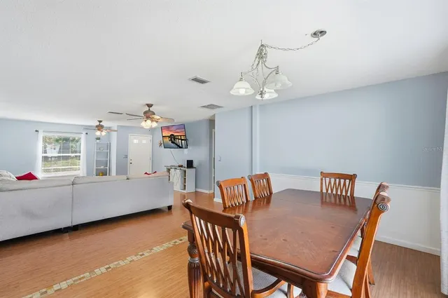 a kitchen with stainless steel appliances granite countertop a refrigerator a stove and a sink