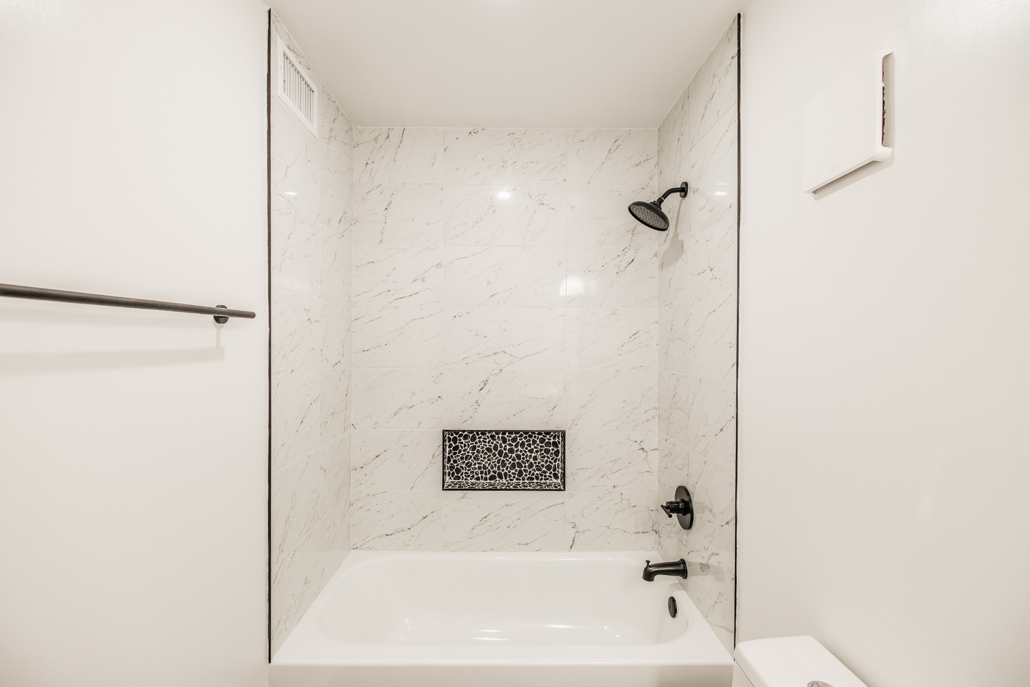 21 Vaughns Gap Road, Unit 55 Nashville, TN 37205 - Photo 23 of 35 a bathroom with a bathtub and a shower