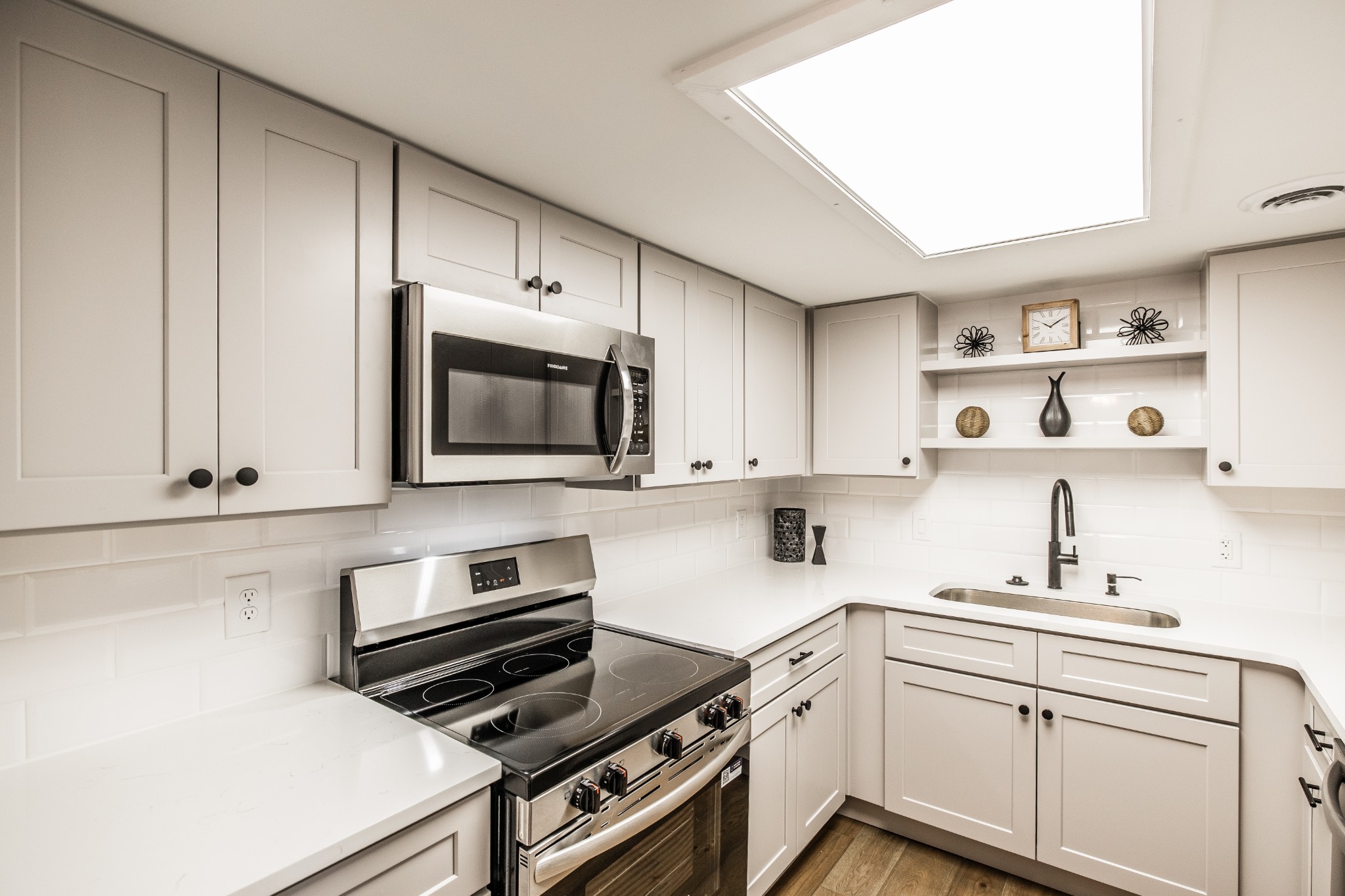 21 Vaughns Gap Road, Unit 55 Nashville, TN 37205 - Photo 3 of 35 a kitchen with cabinets microwave and stove