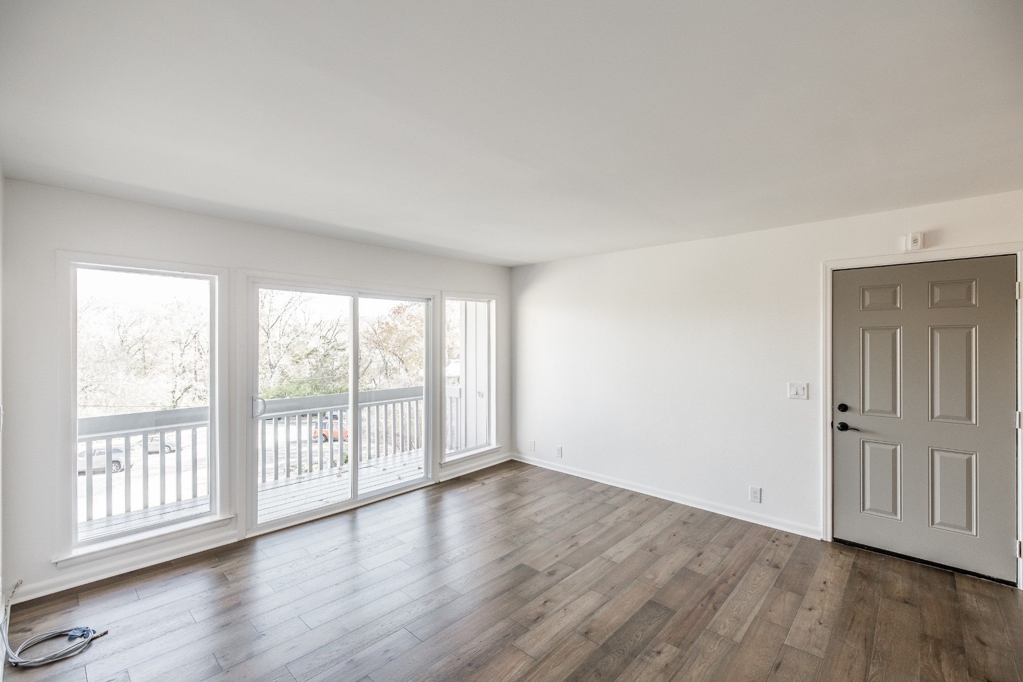 21 Vaughns Gap Road, Unit 55 Nashville, TN 37205 - Photo 6 of 35 wooden floor in an empty room with a window