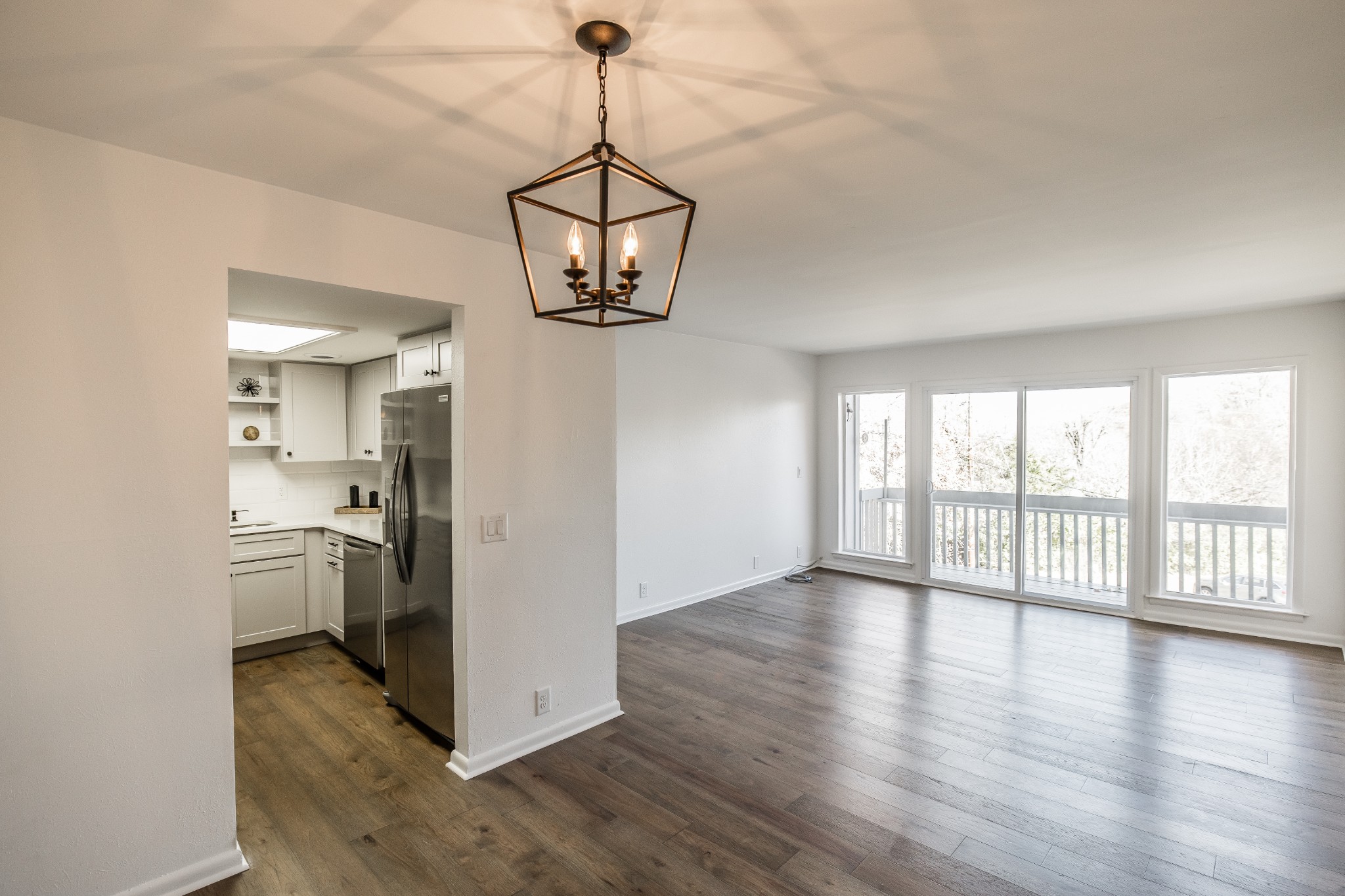21 Vaughns Gap Road, Unit 55 Nashville, TN 37205 - Photo 9 of 35 a view of a kitchen with a stove wooden cabinet a chandelier